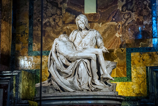 Vatican City, Vatican - December 25, 2012 : The Piety of the Vatican or Pieta is a sculptural group in marble by Michelangelo in the interior of Papal basilica of Saint Peter in Vatican City