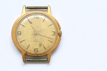 An old broken clock that once showed the time.
