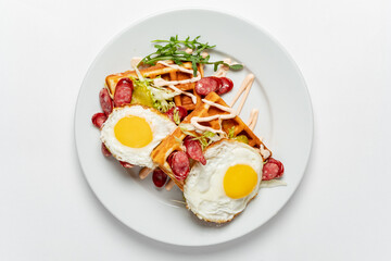 belgian waffle with fried egg and sausage