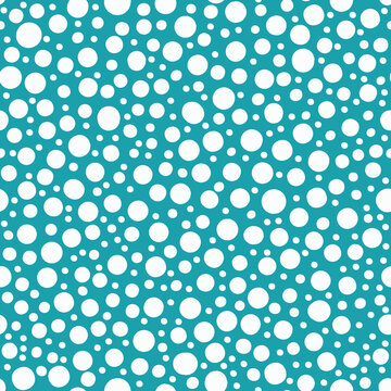 Abstract snowball seamless vector pattern background. Aqua blue white backdrop dense polka dot shapes.Modern snow scattered design with hand drawn varied sizes. All over print for winter frost concept