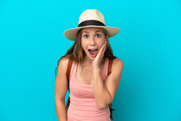 Fototapeta premium Young caucasian woman in summer holidays isolated on blue background with surprise and shocked facial expression
