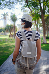 young stylish hipster Asia woman walking on the street