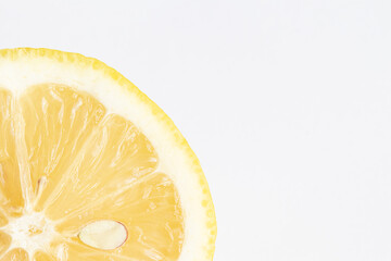 Lemon on a light background. Lemon is added to tea. 