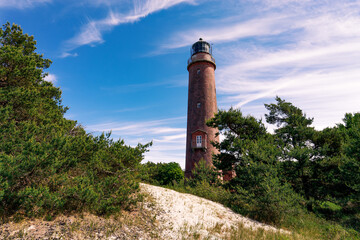 Fototapeta na wymiar Der Leuchtturm am Darßer Ort unweit von Prerow, Inmitten des Nationalparks Vorpommersche Boddenlandschaft.
