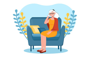 Grey elderly woman is talking on the phone from home