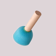 Blue sponge on a wooden handle isolated on white background