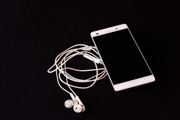 White phone on a black table