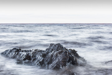 waves crashing on rocks