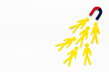 Corporate menegement team concept with horseshoe magnet and human figures