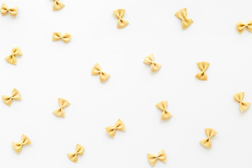 Italian colorful pasta pattern, top view. Various vegan farfalle pasta
