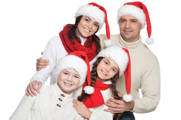 Close up portrait of family with kids in santa hats