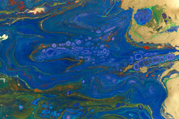 Marble blue and gold abstract background. Navy liquid pattern with golden glitter.