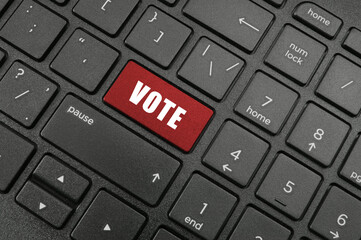 Vote key on laptop computer keyboard