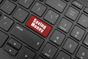 Saving money button on laptop computer keyboard	