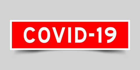 Square label sticker with word covid-19 in red color on gray background