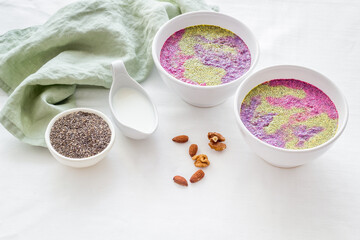 Obraz na płótnie Canvas Vegan Acai detox smoothie bowles with berries and chia seeds