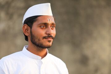Young indian man (pilgrim) in traditional wear.