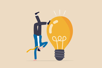 Think different to create unique idea, try another solution to solve business problem, creativity to develop and discover new thing, businessman try different pose to think with idea light bulb. © Nuthawut