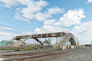 Rusted pedestrian bridge at railway station in Prince Albert Road