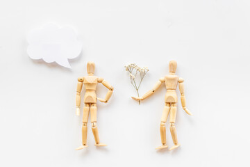 Mental and emotional gender difference between man and woman. Two wooden mannequin figurine connection