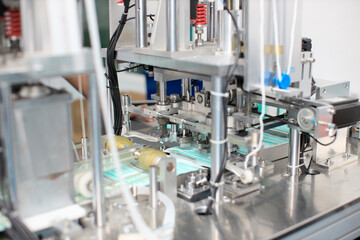 Industry and factory concept, medical face mask production line.