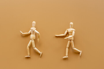 Man and woman connection. Couple of wooden mannequin figures.