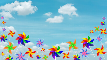 Colorful blades turbines on white cloud, paper rainbow windmill illustration