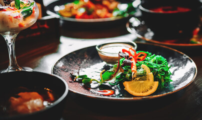Chuka Seaweed Salad in plate on wooden table background