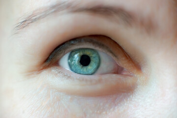 Fototapeta premium Close-up eye of a middle-aged woman without makeup.