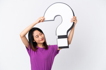 Young Vietnamese woman isolated on white background holding a question mark icon