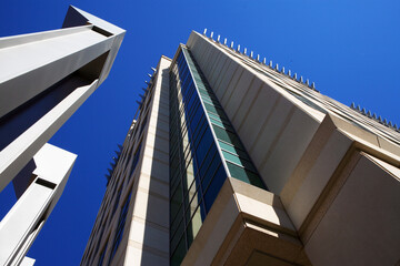 Upward angled shot of modern office business residential apartment building with sky