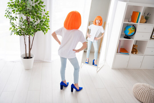 Full body photo of young cheerful school girl happy positive smile look mirror wear dyed wig fitting high-heels shoes stylish indoors