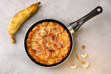 Malabar banana cake kayappola , pazham pola , banana pie made in skillet pan pie pot pie fruitcake made with eggs and Kerala banana for Ramadan, Eid . tea time snack breakfast dessert India Sri Lanka 
