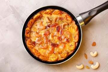 Malabar banana cake kayappola , pazham pola , banana pie made in skillet pan pie pot pie fruitcake made with eggs and Kerala banana for Ramadan, Eid . tea time snack breakfast dessert India Sri Lanka 