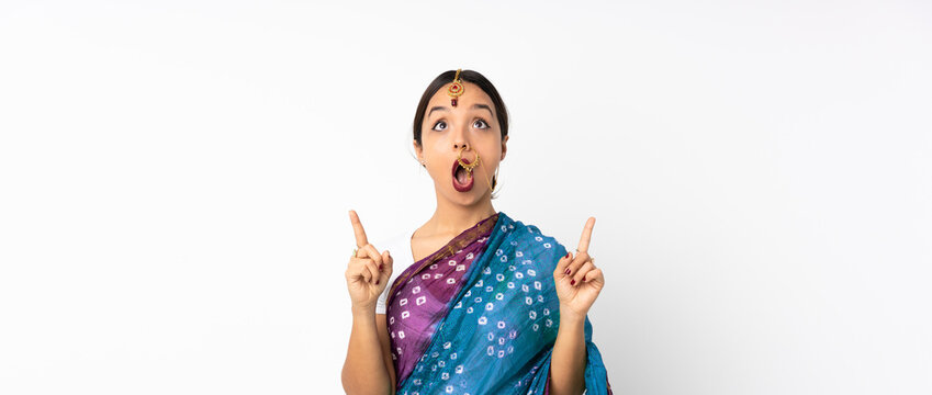 Young Indian Woman Isolated On White Background Surprised And Pointing Up