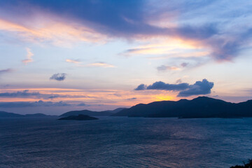 Fototapeta na wymiar Beautiful colorful sunset over the sea and the mountains