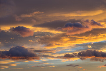 Naklejka na ściany i meble scenic sunset in Spain and colorful clouds abstract background