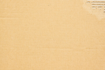 Clean yellow cardboard real texture with rip in one corner