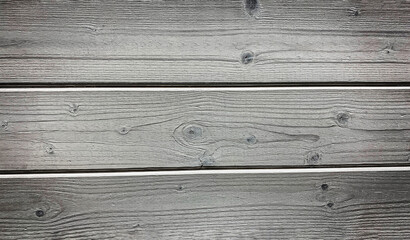 Planks of an old barn wooden horizontal gray background close-up