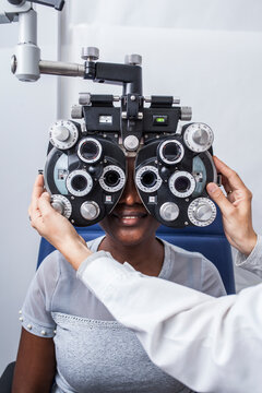 Black woman in optometry cabinet