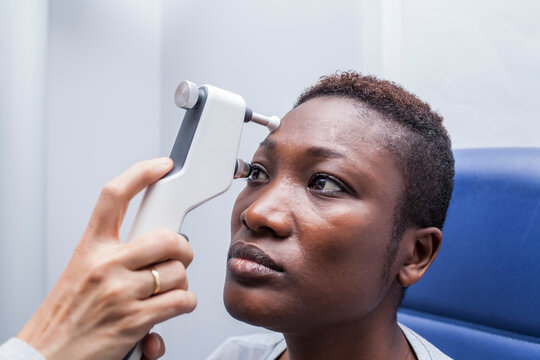 Black woman in optometry cabinet