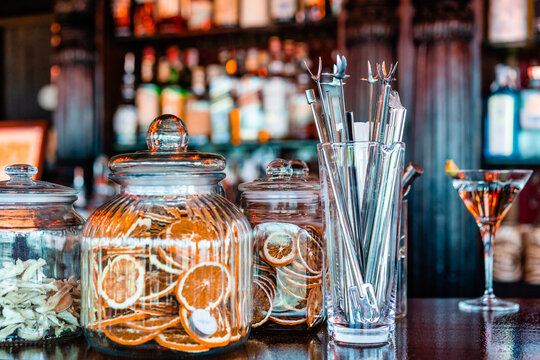 Bartender tools and decorations on counter in bar