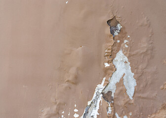 Closeup of peeling painted wall.