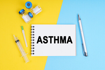 A syringe, ampoules and a notebook with the inscription - ASTHMA