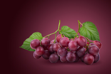 Bunches of fresh ripe red grapes on a red background.