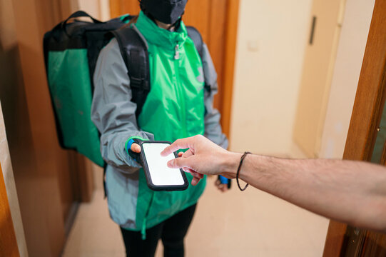 Man paying for delivery during pandemic