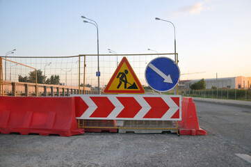Road signs repair work, bypass obstacles on the right.