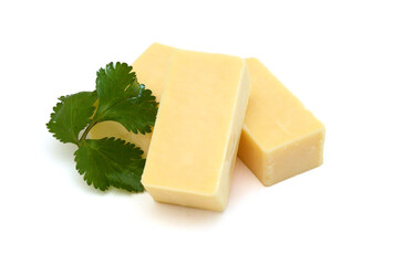 Cubes of cheddar cheese isolated on white 