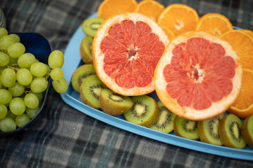 Fruit at a picnic. Mango and kiwi.
