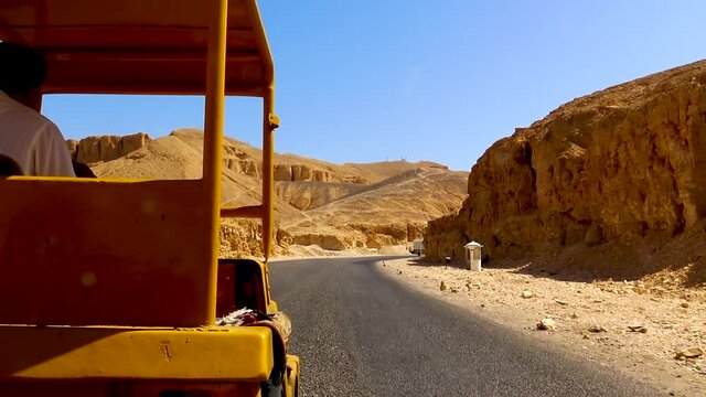 View from touristic vehicle during ride trough Valley of the Kings in Egypt.